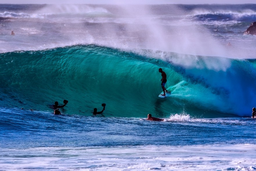 surfers riding a wave